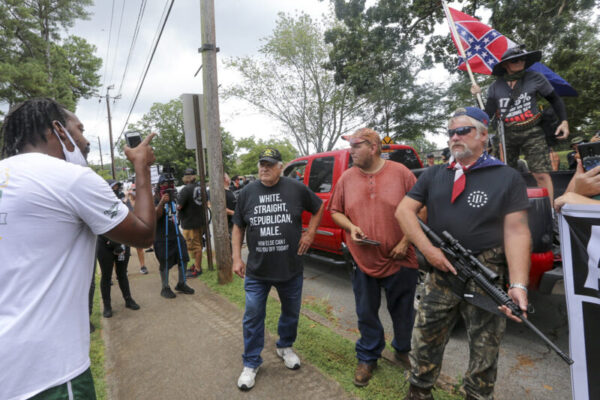 Counter protesters face off with protesters as several far-right groups, including militias and white supremacists, rally Saturday, August 15, 2020, in Stone Mountain, GA, USA, while a broad coalition of leftist anti-racist groups organized a counter-demonstration. Photo by Jenni Girtman/Atlanta Journal-Constitution/TNS/ABACAPRESS.COM